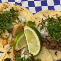 Street Taco · Choice of meat. Served with diced white onions, cilantro and limes.