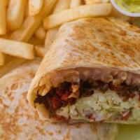 Traditional Burrito · Refried beans, rice, lettuce, cream, homemade guacamole, choice of meat, in a large flour to...