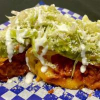 Chimichanga De La Casa · Refried beans, cheese, your choice of meat, in a fried flour tortilla topped off with cream,...