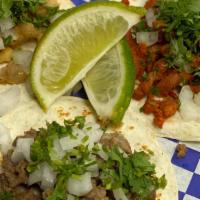Taco Platter · Three tacos with your choice of one meat, served with Mexican style rice and refried beans.