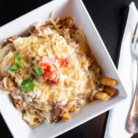 Lechon Disco Fries (Ah-May-Zing) · Fries topped with pemil, mozzarella cheese and pork gravy made from scratch.