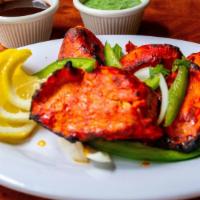 Chicken Tikka · Boneless pieces of chicken breast marinated with yogurt and tandoori spice blend and cooked ...