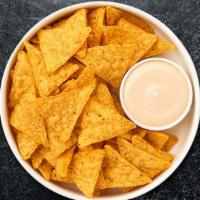 Queso Queen & Chips · Homemade melted cheese dip with warm tortilla chips.