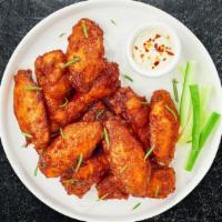 Mild Child Wings · Fresh chicken wings breaded, fried until golden brown, and tossed in mild sauce. Served with...