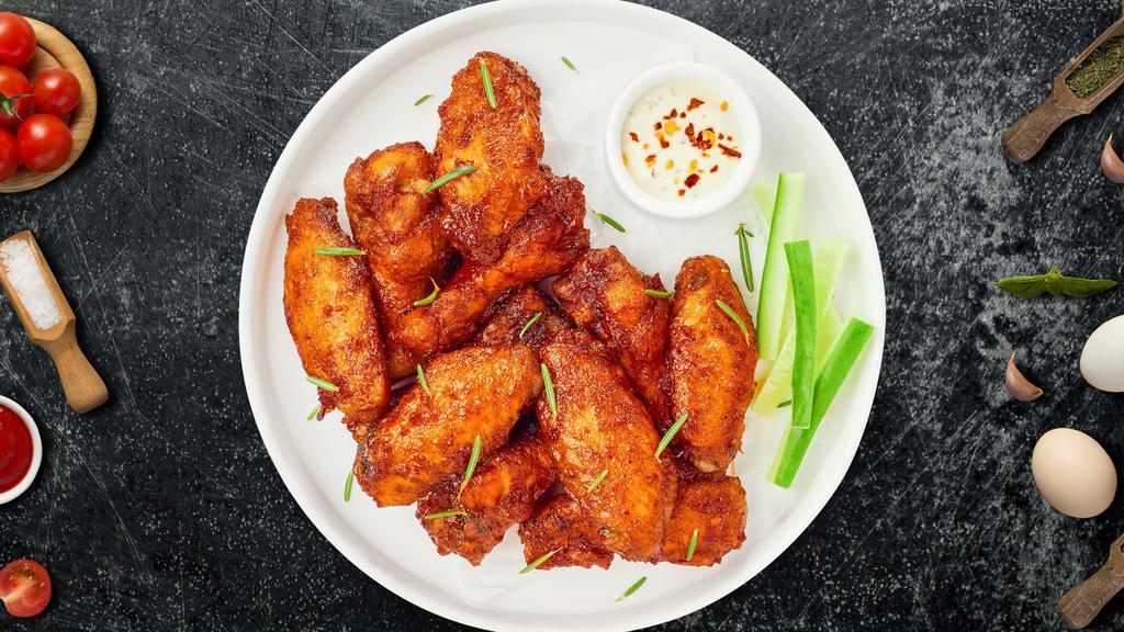 Mild Child Wings · Fresh chicken wings breaded, fried until golden brown, and tossed in mild sauce. Served with a side of ranch or bleu cheese.