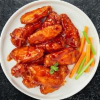 Sriracha Szn Wings · Fresh chicken wings breaded, fried until golden brown, and tossed in sriracha sauce. Served ...