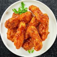 Bbq Boi Boneless Wings · Fresh boneless chicken wings breaded, fried until golden brown, and tossed in barbecue sauce...