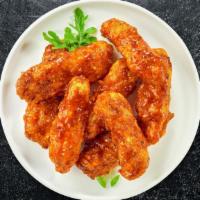 Chipotle Glaze Bbq Boneless Wings · Fresh boneless chicken wings breaded, fried until golden brown, and tossed in chipotle barbe...