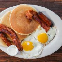 Breakfast Combo · Two eggs (any style), three hot cakes and two strips of bacon and two sausage links.