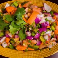 Kachumber Salad · Cucumbers, tomatoes, carrots, chickpeas served with a house dressing