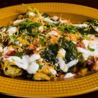 Palak Chaat · Crispy spinach fritters with sweetened yogurt and coated with chutneys