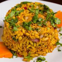 Bhel Puri · Puffed rice mixed with finely chopped onions and tomatoes, savory morsels and topped with ch...