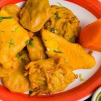 Assorted Pakora Platter · Deep-fried fritters of potatoes, onions, long hots, and paneer cheese