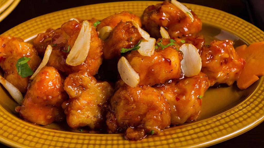 Jashan Lasoni Gobi · Battered cauliflower sauteed in a tangy sauce with garlic, onions, and bell peppers