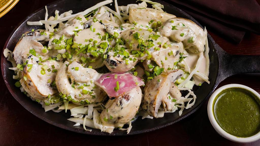 Malai Mushroom · Hand-picked mushrooms, skewered and cooked to perfection in a tandoor oven and drenched with creamy house special marinade
