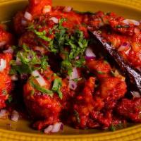 Murgh 65 · Chicken fried with rice and cornflour, sauteed in red chili-yogurt marinate, curry leaves, a...