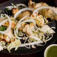 Malai Kebab · Spring Chicken marinated in a white creamy marinade, roasted in a tandoor oven and served wi...