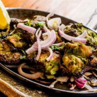 Hariyali Kabab · Boneless spring chicken marinated overnight in a mint-cilantro marinade, roasted in a tandoo...