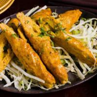 Chicken Seekh Kebab · Skewered minced chicken skewered and cooked in a tandoor oven, cut into small bite-sized pie...