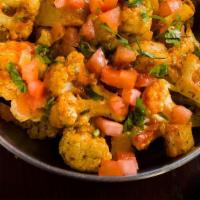 Aloo Gobhi Ghar Ki · Potatoes and Cauliflower with garam masala, cilantro, cumin, and coriander, made till dry.