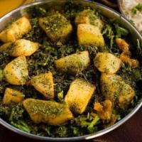 Aloo Methi · Potatoes with fenugreak leaves blended with indian spices and herbs.