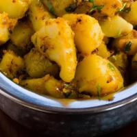 Jeera Chili Aloo · Potatoes tossed with cumin