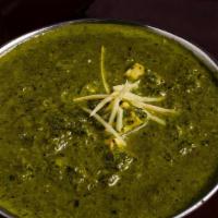 Palak Paneer · Creamed spinach & cheese made with garden herbs and topped with ginger