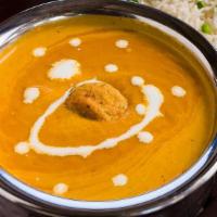 Malai Kofta · Vegetable croquettes in creamy nut sauce topped with ground cashew and milk cream