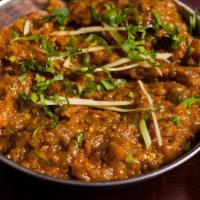 Baingan Bharta · Eggplant smoked in tandoor, minced, and prepared with onions, tomatoes, and garden herbs top...