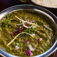 Sarson Ka Saag · Spinach and mustard greens topped with ghee and green chilies