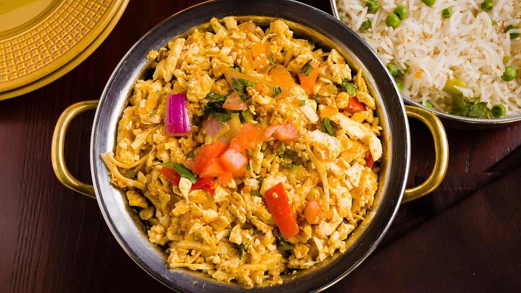 Paneer Khurchan · Grated paneer cheese curry prepared with onions and tomatoes and topped with chopped thin tomatoes