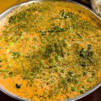 Mutter Paneer · Paneer cheese and peas in creamy preparation topped with dried fenugreek  leaves