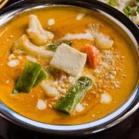 Navratan Korma · Mixed vegetable in creamy nut sauce made to perfection with ground nuts as toppings