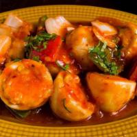 Chili Anda · Boiled egg sauteed in tangy sweet-chili sauce, topped with cilantro and scallions