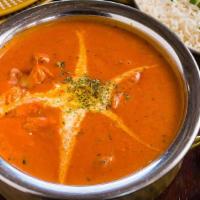 Jashan Murgh Makhani · Chicken in creamy tomato sauce with bell peppers and topped with clarified butter.