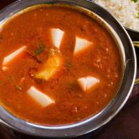 Murgh Vindaloo · A very hot chicken curry cooked with red chilies, vinegar, potatoes.