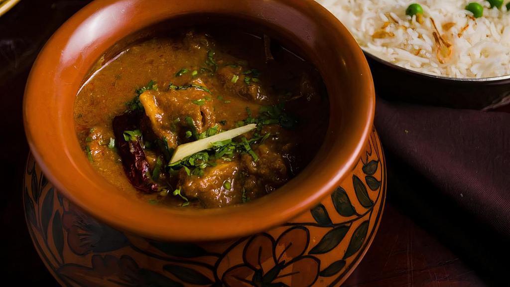 Handi Bone-In Murgh Curry · Bone-in chicken curry in onion sauce cooked in a traditional ceramic handi