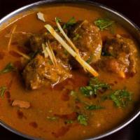 Jashan Goat Curry · Homestyle punjabi bone-in goat curry.