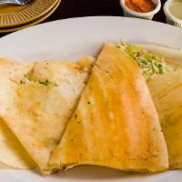 Mysore Masala Dosa · Rice crepe spread with spicy homemade sauce and filled with mashed potatoes and onions