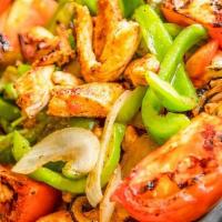 Steak Fajitas · Hot and fresh steak fajitas mixed with chopped onions, tomatoes, and bell peppers! also incl...