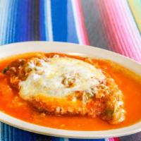 Chile Relleno With Sauce And Cheese · Anaheim Chile stuffed with monterey jack cheese drenched in egg batter fried to perfection! ...