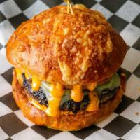 Ring Of Fire · Pepper Jack Cheese, Jalapenos, Onion Rings, and Sriracha Mayo. Served on a Cheddar & Jalapen...
