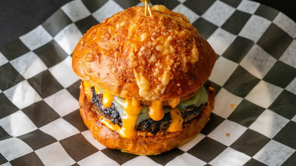 Ring Of Fire · Pepper Jack Cheese, Jalapenos, Onion Rings, and Sriracha Mayo. Served on a Cheddar & Jalapeno Bun. Consuming raw or undercooked meats, poultry, seafood, shellfish, or egg may increase your risk of foodborne illness, especially if you have certain medical condition.