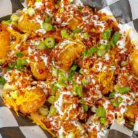 Loaded Tots · Loaded with Cheddar, Bacon, Sour Cream, and Scallions