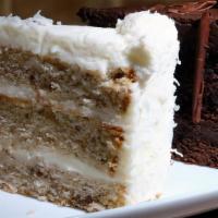 Italian Creme Cake · A rich vanilla cake filled with coconut and pecans, topped with a cream cheese frosting.