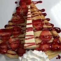 Cheesecake Crepe · Cheesecake, strawberries, and raspberry sauce.
