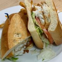 Beer Battered Fish Sandwich · Galway Bay beer-battered cod, shredded lettuce, tomatoes & tartar sauce; served on a long ro...