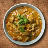 Chicken Chop Korma · Chicken korma Cooked with tomato sauce, cream, and Indian spices.