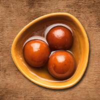 Gulab Jamun · Soft delicious berry sized balls made of milk solids, flour & sugary syrup.