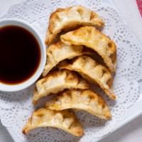 Pot Sticker (7) · 7 pieces of authentic chicken and vegetable Gyoza.